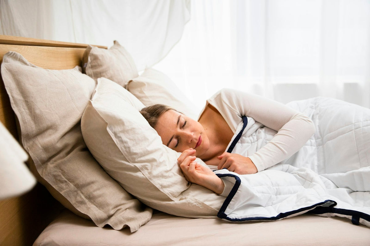 Woman resting her head on soft pillows